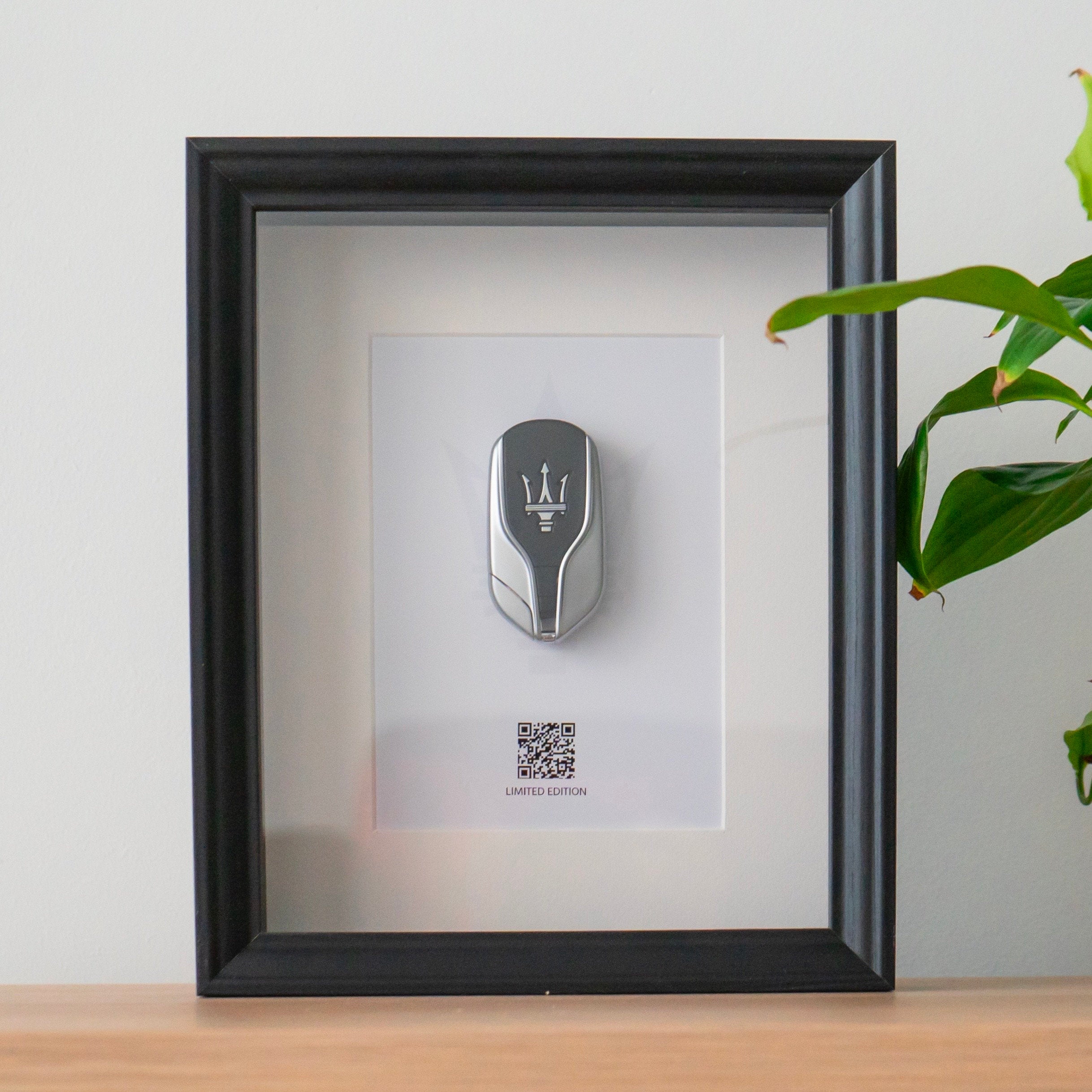 Framed Maserati key decoration