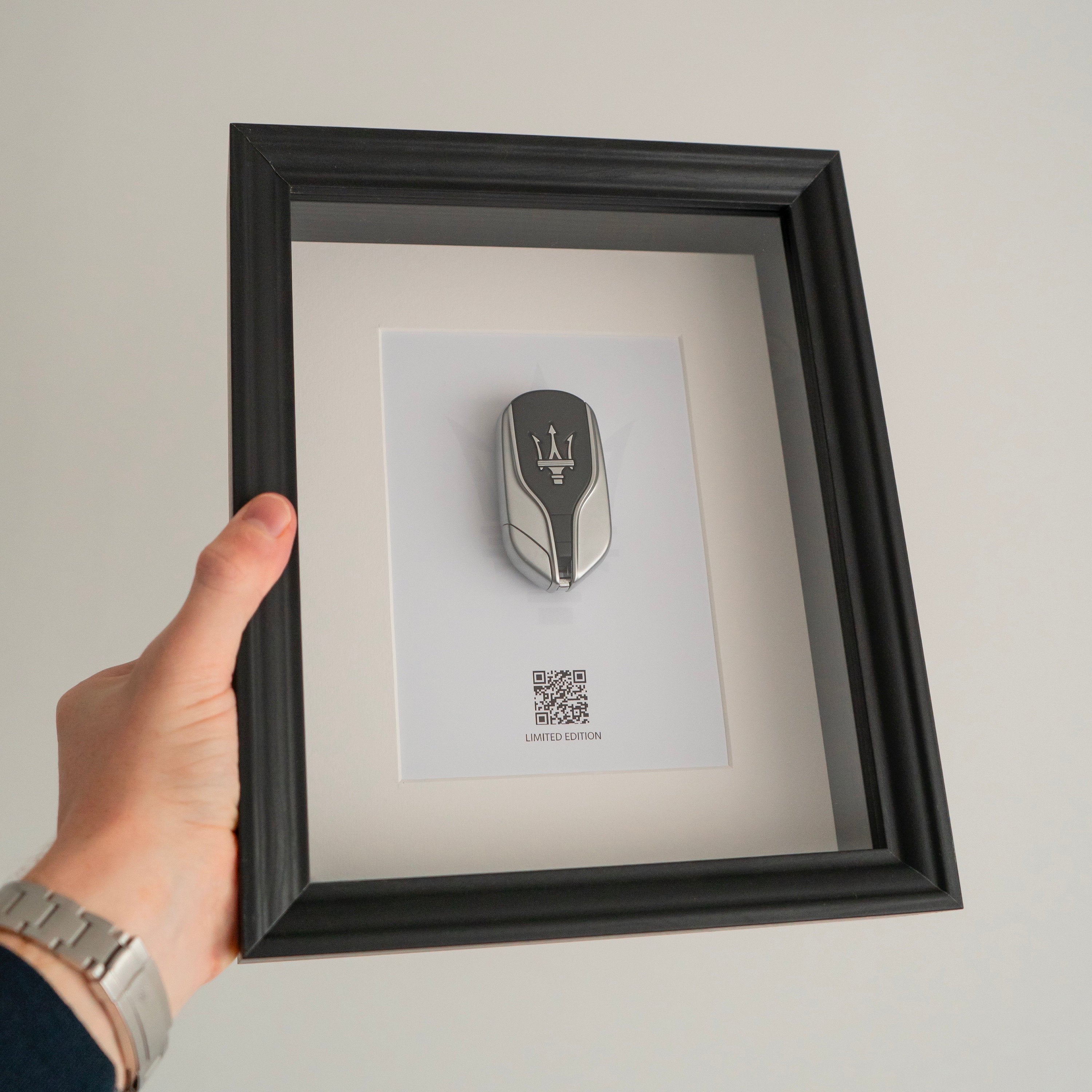 Framed Maserati key decoration