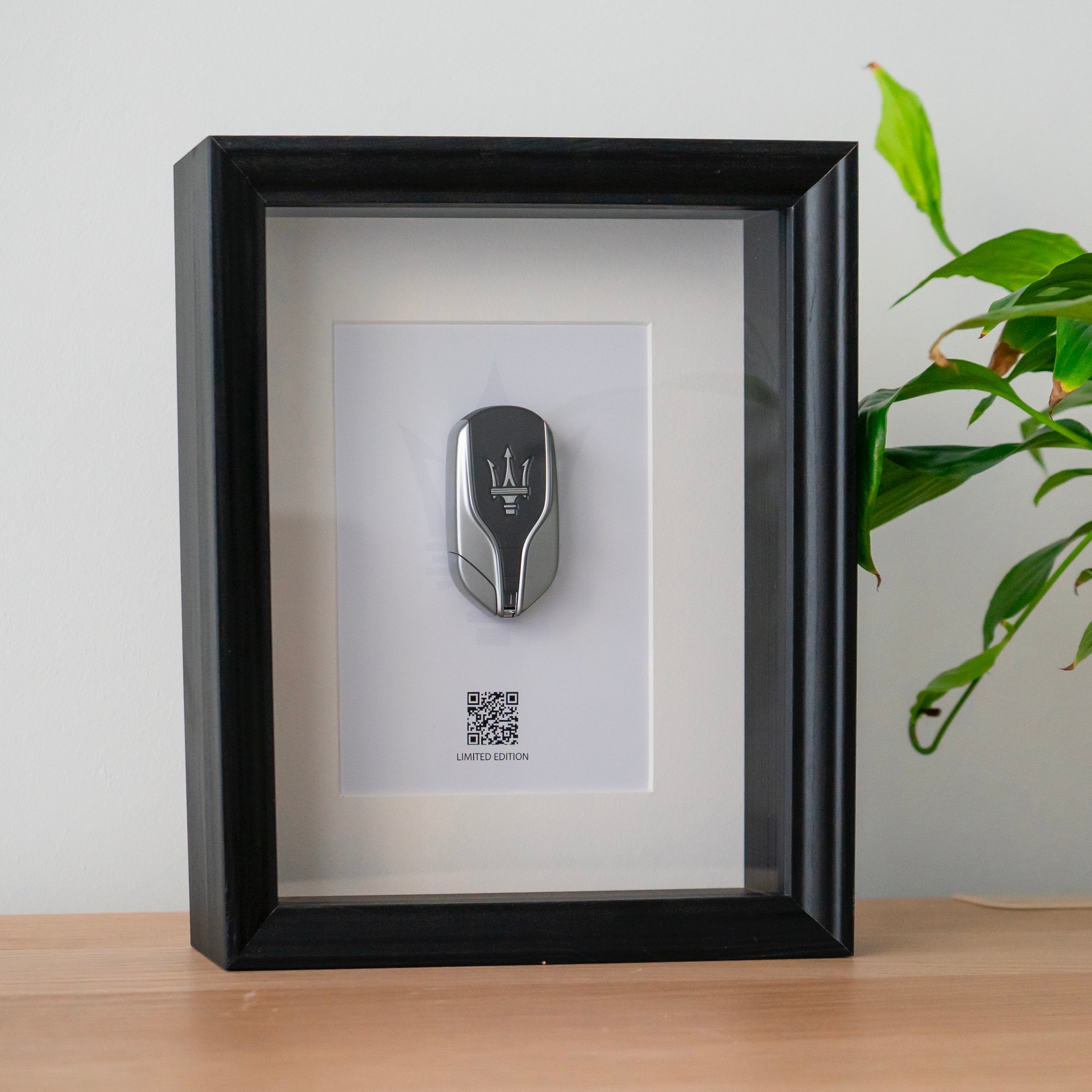 Framed Maserati key decoration